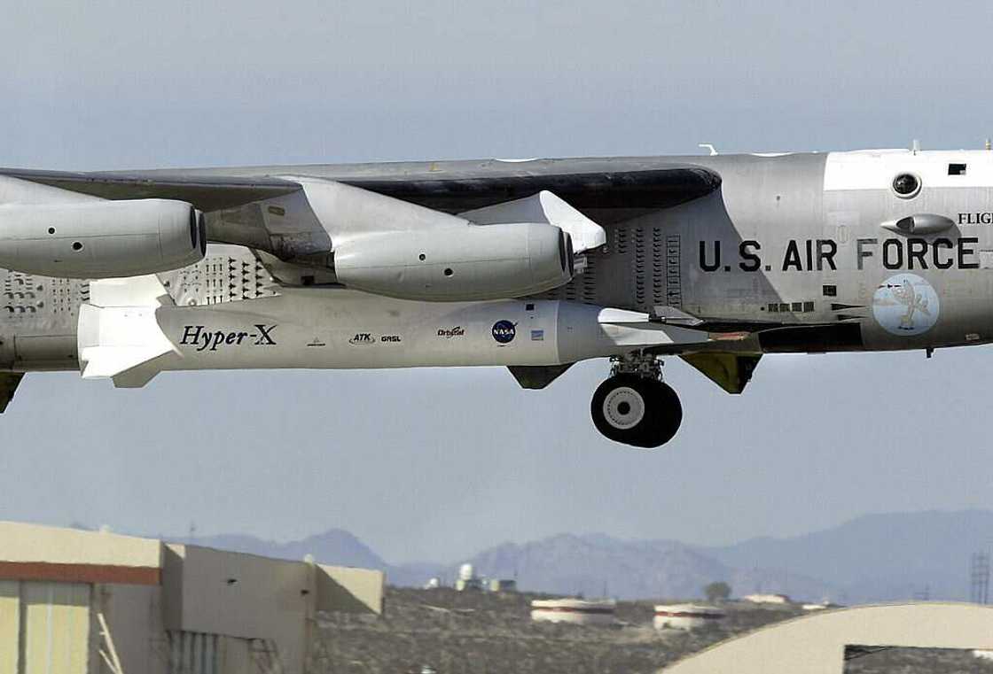 A B-52B launch aircraft lifts off with NASA's X-43A hypersonic research aircraft and its modified Pegasus booster rocket