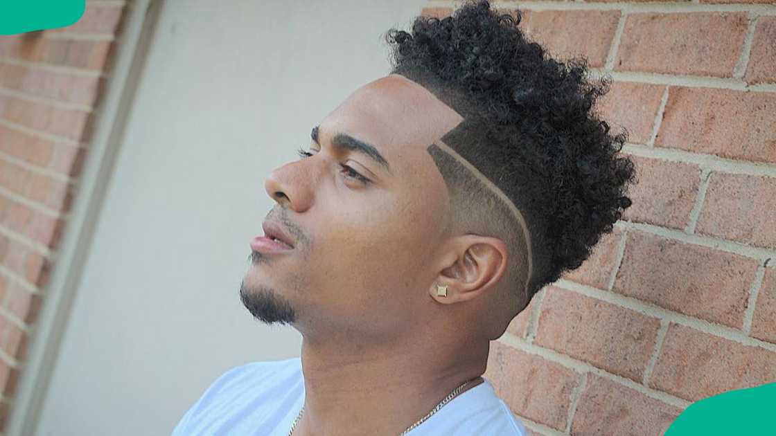 Medium high-top fade with design hairstyle for men