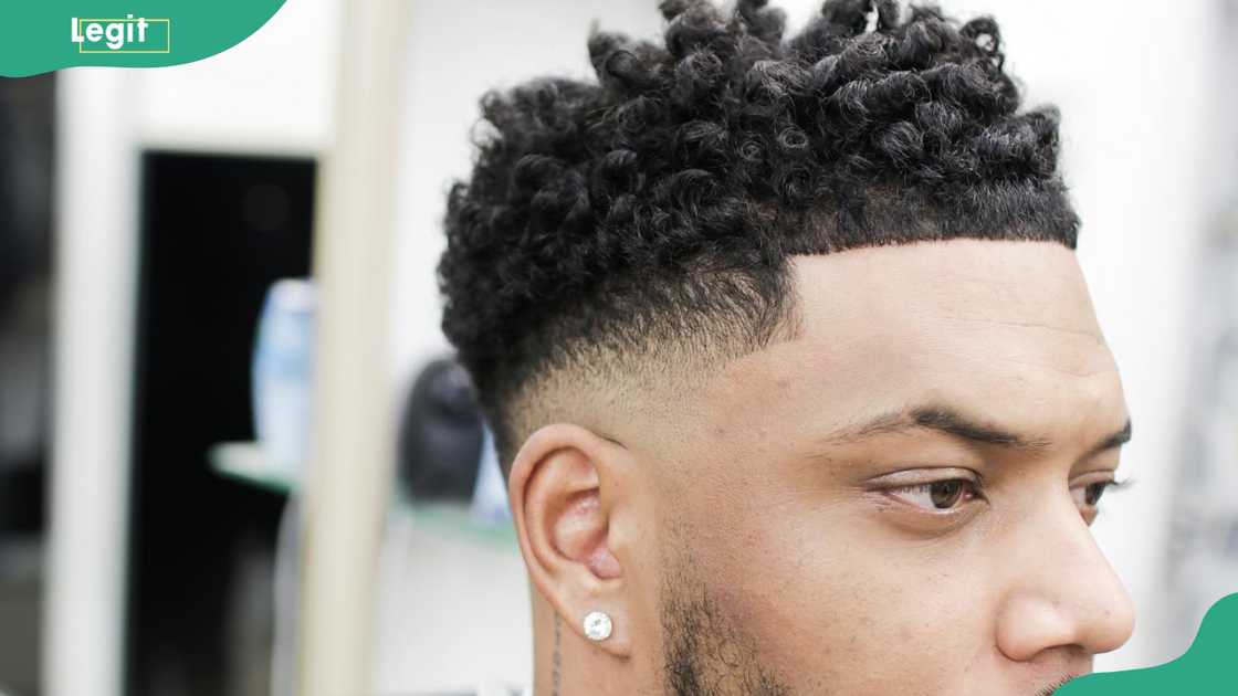 curly fade with neat edges hairstyle for men