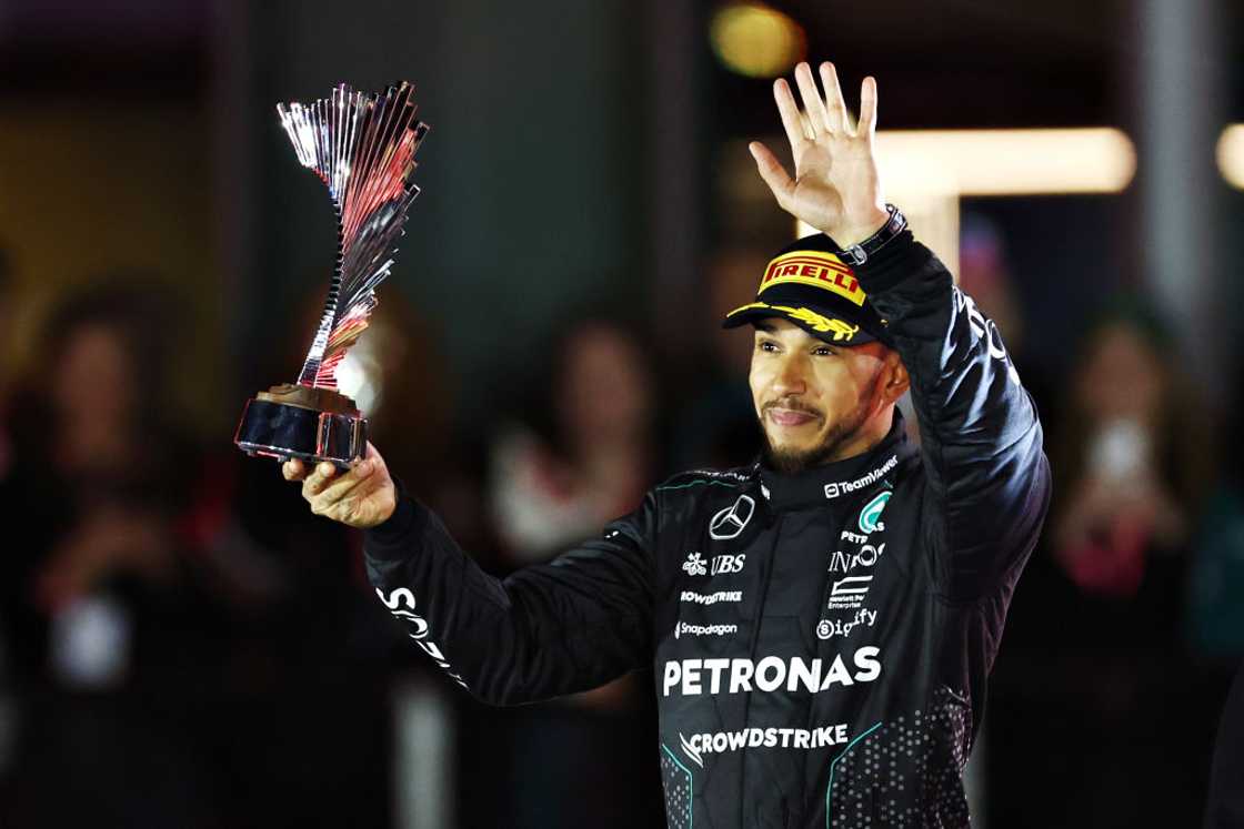 Lewis Hamilton celebrates on the podium