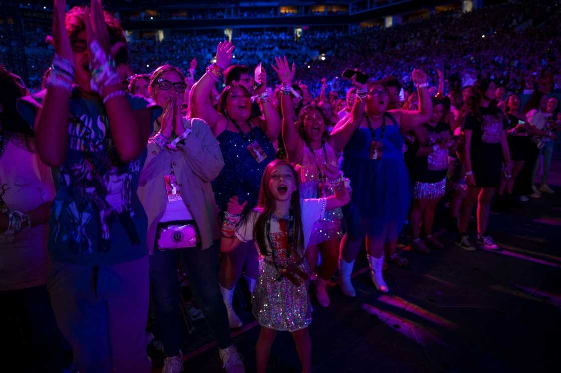 Fans of US singer Taylor Swift cheer during one of her shows in Miami