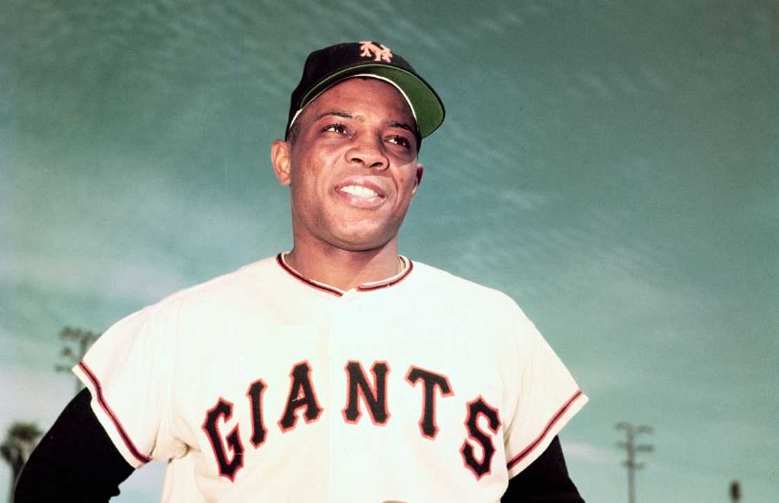 Willie Mays of the New York Giants posing for a photo