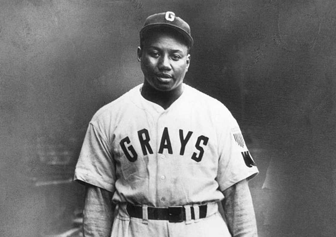 A black and white portrait of Josh Gibson