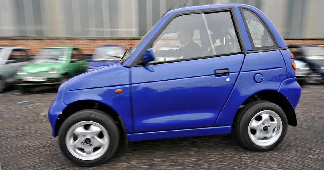 A blue G-Wiz electric car on display