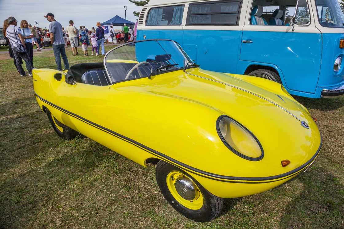 A yellow Goggomobil Dart microcar on display