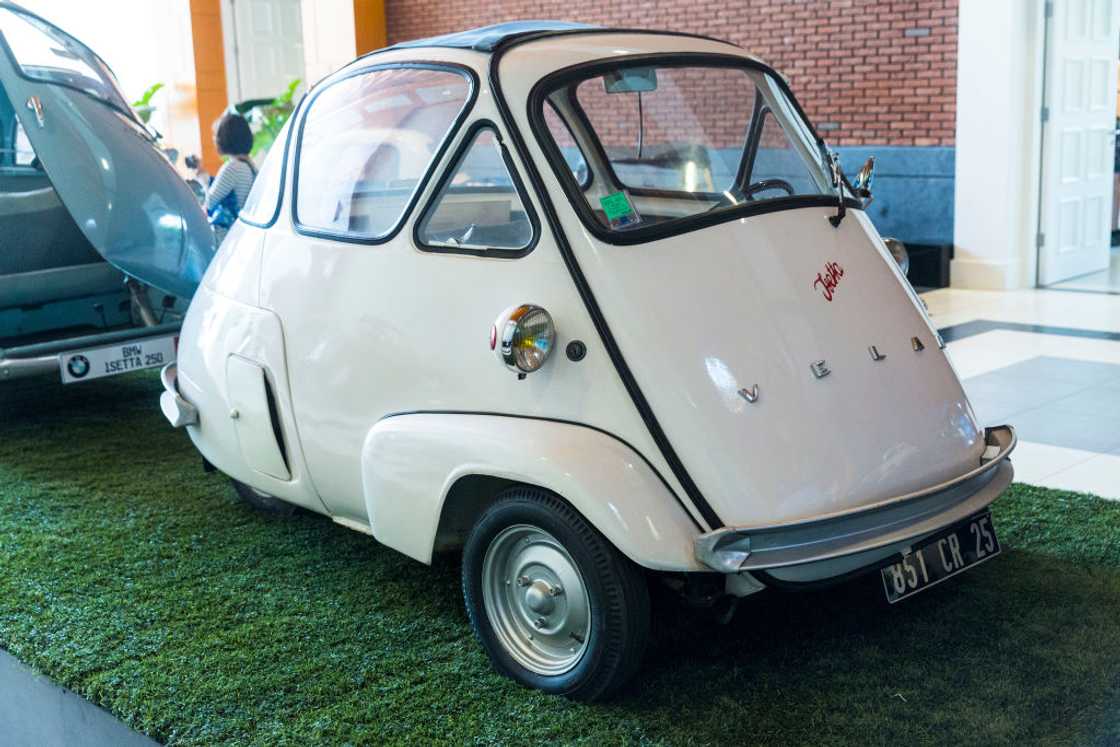 A white Velam Isetta is on display