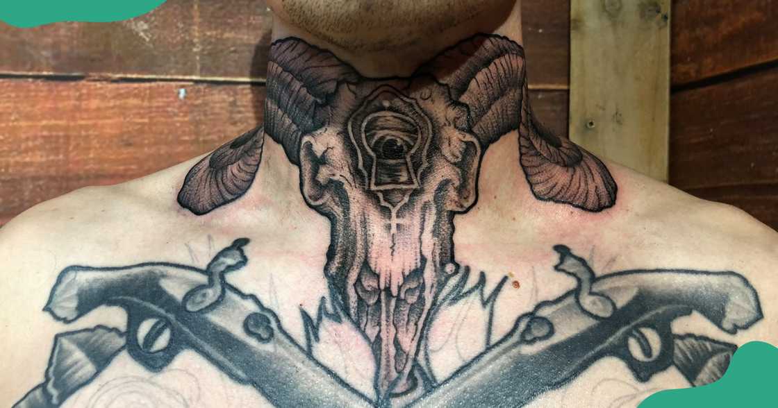 A skull tattoo based on the Capricorn symbol on a man's throat.