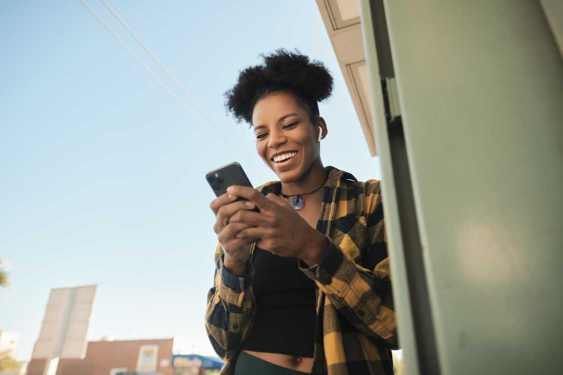 A young woman using a phone