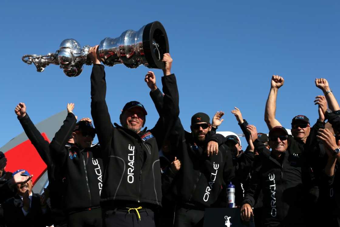 Oracle CEO Larry Ellison and Oracle Team USA celebrates onstage in San Francisco after the America's Cup in 2013