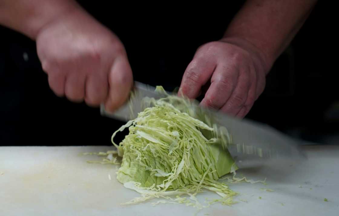 Last year's record summer heat and heavy rain ruined crops, driving up the cost of the leafy green in what media have dubbed a 'cabbage shock'