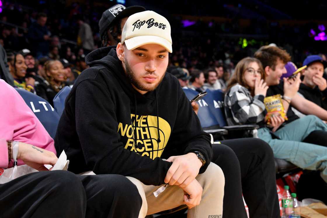 Adin Ross attends a basketball game in Los Angeles, California