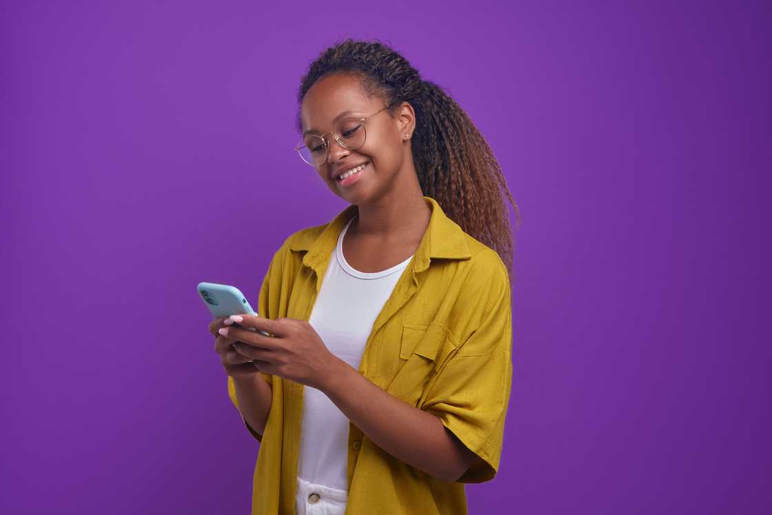 A woman using a phone.