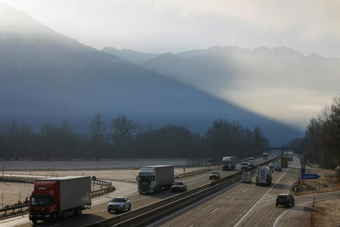 Cars and trucks on the Autobahn close to the highway exit of Oberaudorf, southern Germany on February 6, 2025