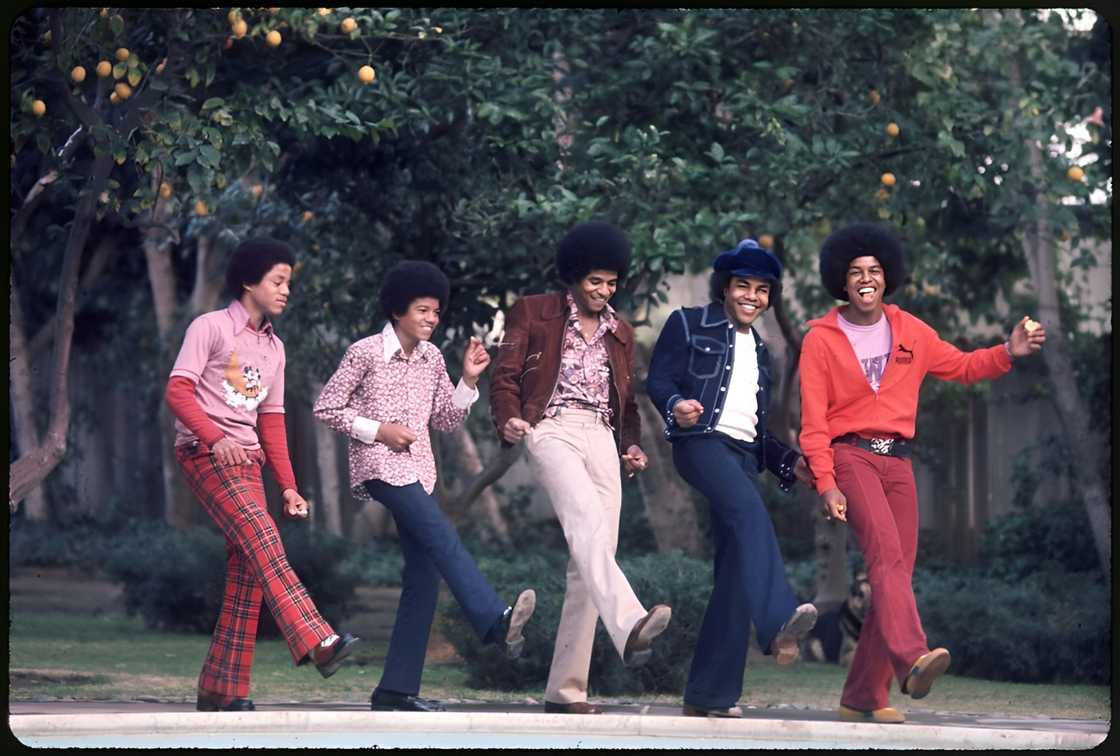 R&B quintet The Jackson Five pose for a portrait in the backyard of their home. From left to right, Marlon Jackson, Michael Jackson (1958 - 2009), Jackie Jackson, Tito Jackson and Jermaine Jackson