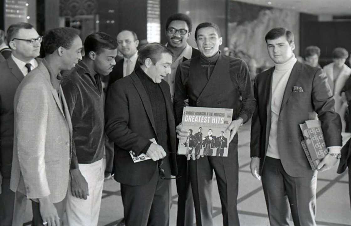 American singer, songwriter and record producer Smokey Robinson with Ronnie White, Bobby Rogers and Pete Moore, collectively known as The Miracles, at an event for Prom Magazine
